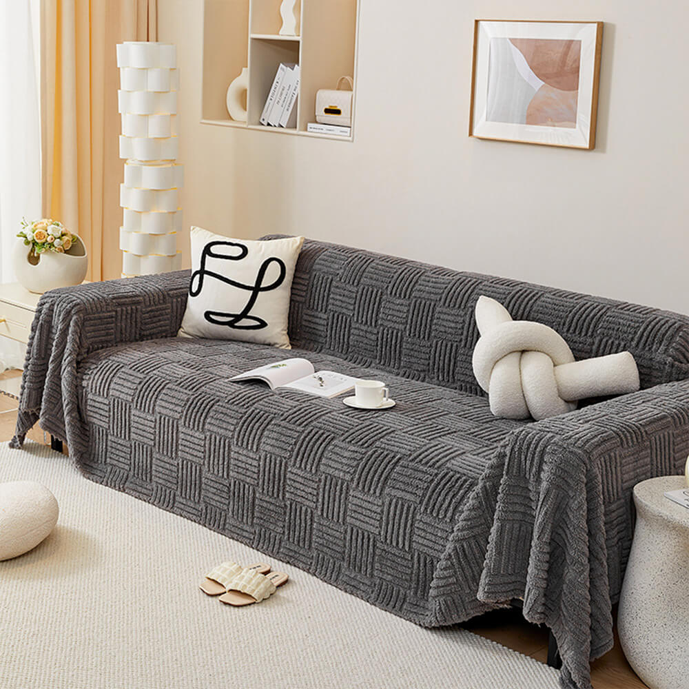 Oregelbundet rutigt randigt puffade sammetsoffatäcke Carvallo