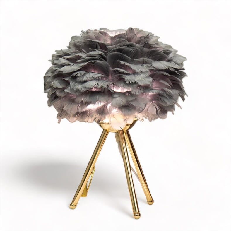 Elegant fjädrar bordslampa med mjukt gyllene ambient ljus Carvallo