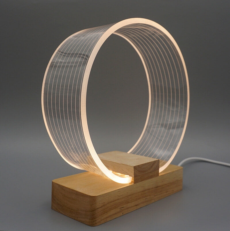 Nordic Minimalist Ringlampa – Genomskinlig akryl med träfot MILA Sverige