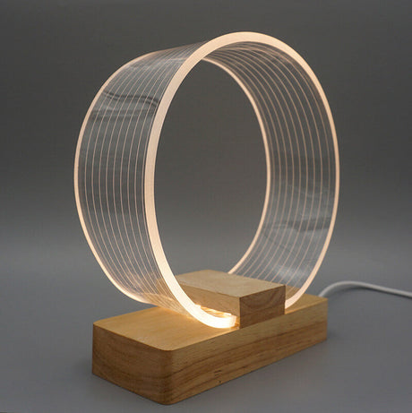 Nordic Minimalist Ringlampa – Genomskinlig akryl med träfot MILA Sverige