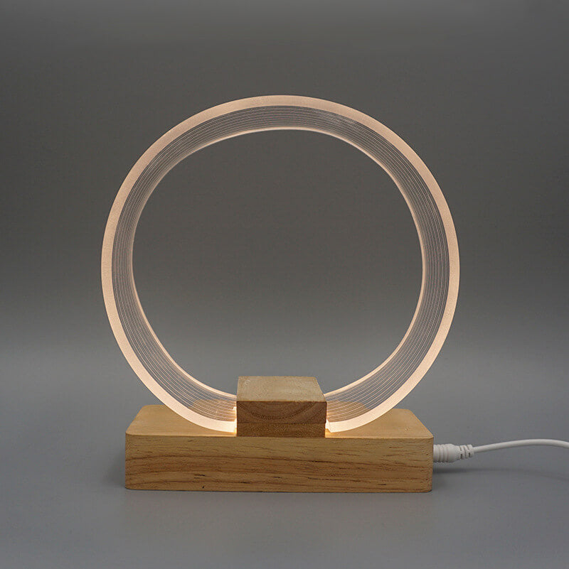 Nordic Minimalist Ringlampa – Genomskinlig akryl med träfot MILA Sverige
