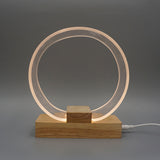 Nordic Minimalist Ringlampa – Genomskinlig akryl med träfot MILA Sverige