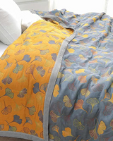 Carvallo – Lyxig bomullsfilt med fint lövmönster för värme och stil Carvallo