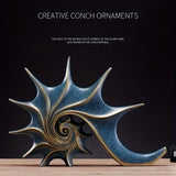 Elegant blå & guld snäckskulptur - Lyxig harts kustfantasi heminredningsdekor MILA Sverige