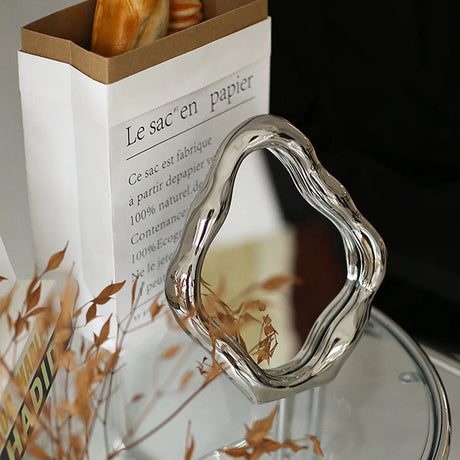 Squiggly Mirror - Nordisk elektropläterad silverdesign Carvallo