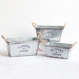 Dekorativ blomster- och trädgårdsbehållare i metall med hampasnörehandtag Carvallo