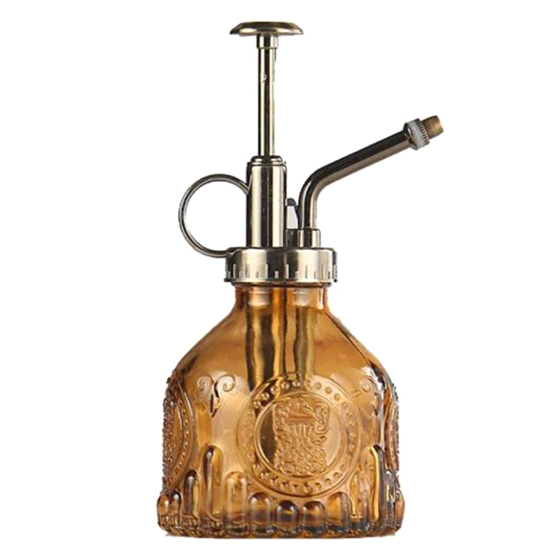 Präglad glasflaska med metallmunstycke – växtspruta för blommabesträckning i vintage-design Carvallo