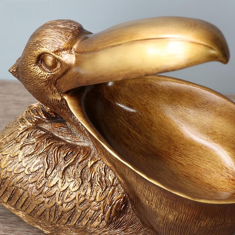 Topika – Skulpterad pelikankorg i harts MILA Sverige