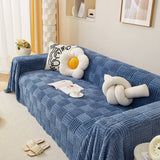 Oregelbundet rutigt randigt puffade sammetsoffatäcke Carvallo