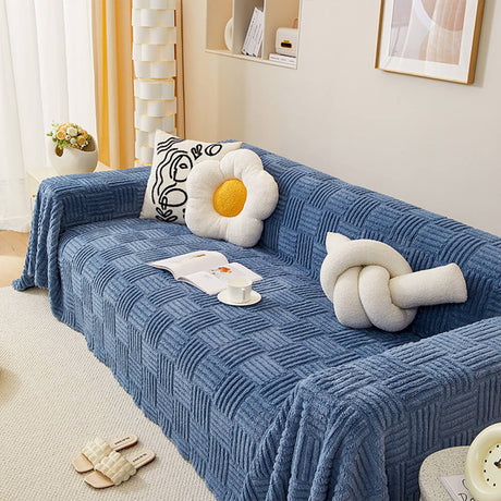 Oregelbundet rutigt randigt puffade sammetsoffatäcke Carvallo