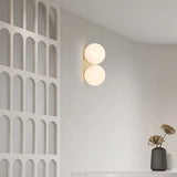 DualGlow - Guld Vägglampa med Dubbel Glasskula Carvallo