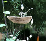 Fiskarvindklocka – Skulptur i återvunnen metall för fiskträdgård MILA Sverige