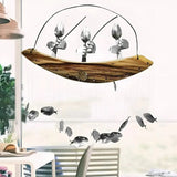 Fiskarvindklocka – Skulptur i återvunnen metall för fiskträdgård MILA Sverige