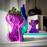 MuseDrop – Surrealistisk tjejfigur-plantekasse med kompakta växter Carvallo