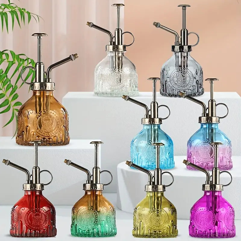 Präglad glasflaska med metallmunstycke – växtspruta för blommabesträckning i vintage-design Carvallo