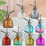 Präglad glasflaska med metallmunstycke – växtspruta för blommabesträckning i vintage-design Carvallo