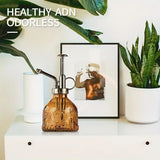 Präglad glasflaska med metallmunstycke – växtspruta för blommabesträckning i vintage-design Carvallo