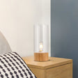 Elegant cylindrisk bordslampa med träbas för mysiga interiörer Carvallo