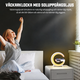 Väckarklocka med trådlös laddning och högtalare