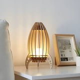 Trä-nattbordslampa i raketdesign – Varmt ljus för ett mysigt sovrum Carvallo