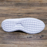 Andningsaktiva stickade sneakers för kvinnor
