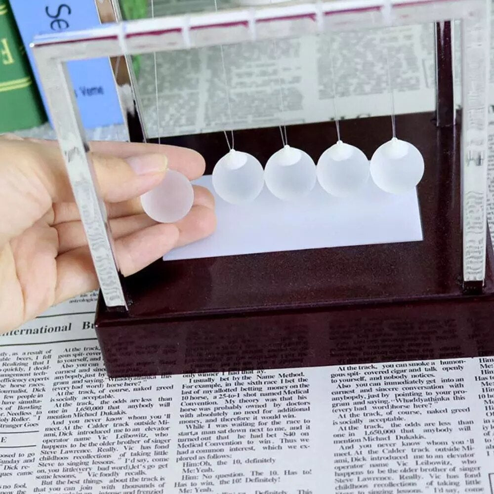 NeoMotion – LED Newtons Pendel för Hypnotiserande Rörelse och Ljuslek Carvallo