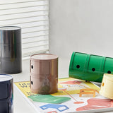 Sängbord med runda plastförvaringslådor Carvallo